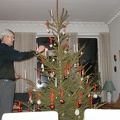 Malou's dad Arne lighting the candles on the christmas tree