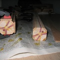 Once the amrs and legs are in and the corners chopped off of the block, I start glueing on the outer band made of cherry.