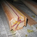 Next, I glue in the arms and legs, one at a time.  The wood this year is purpleheart.