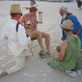 Two guys helped wash her feet, while the third one sang a song with his accordian.