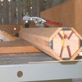 I attach the block to my table saw sled with a clamp so my fingers aren't close to the blade.