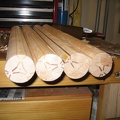 Use a lathe and hand plane to round over the logs.