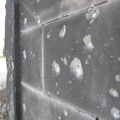 Bullet holes in a cemetery wall